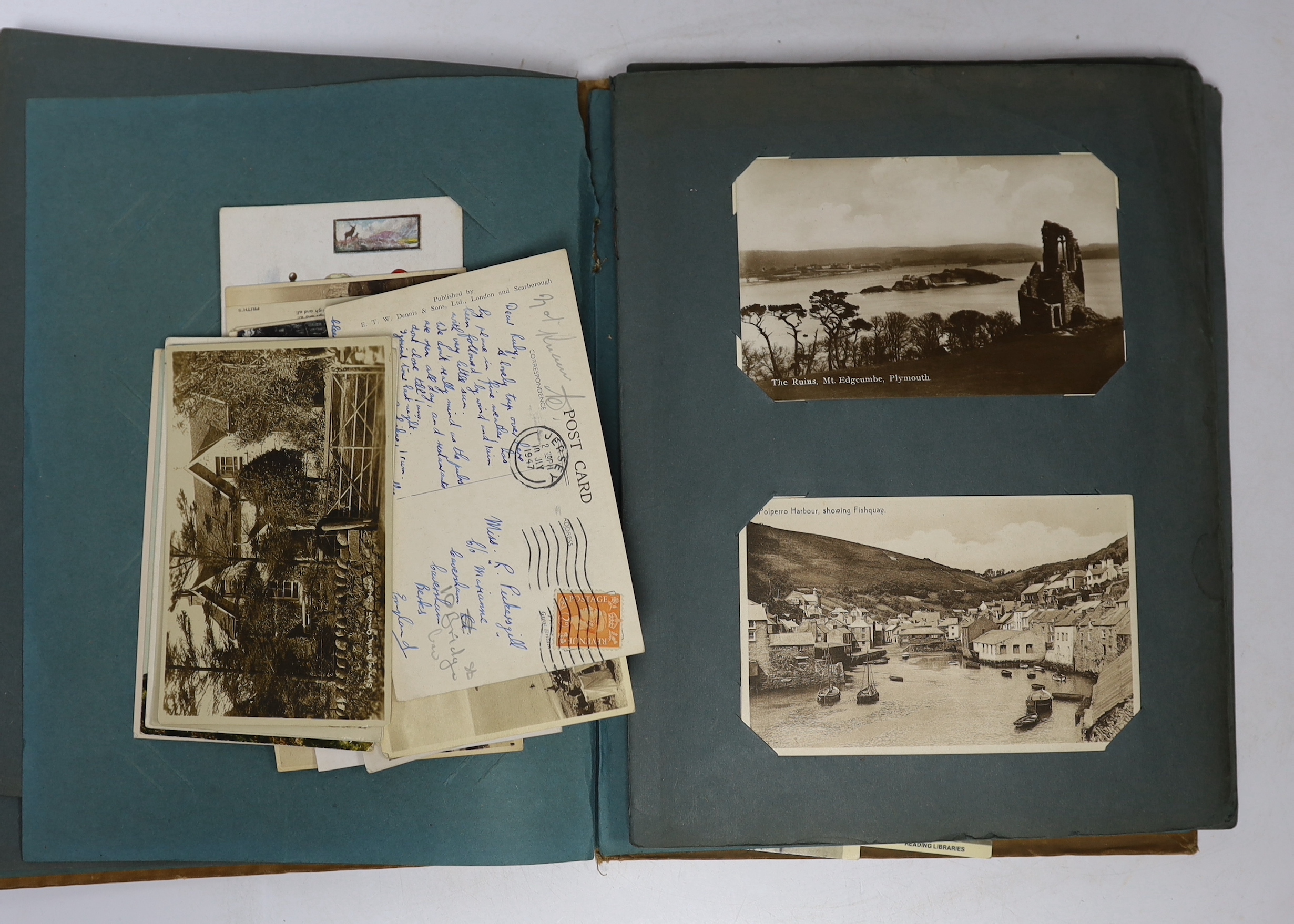 A postcard album and various early 20th century postcards, of various views of UK towns, etc.